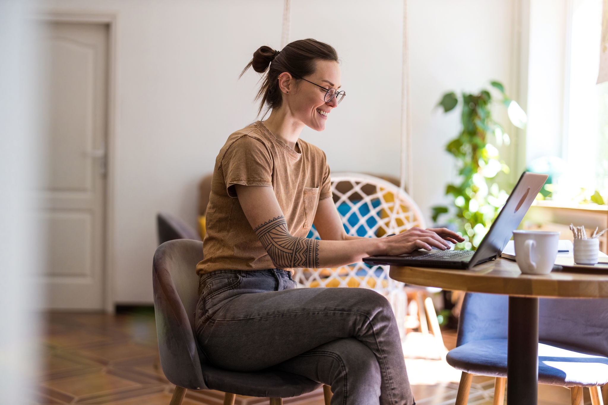 Young woman using a laptop at home