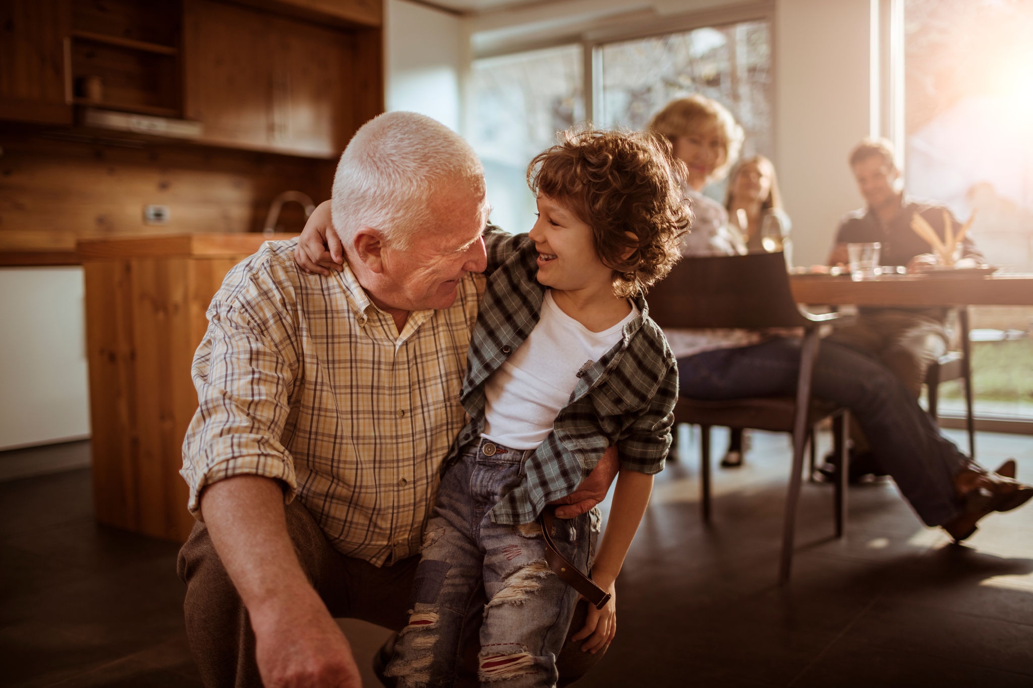 Close up of a grandfather playing with his grandson