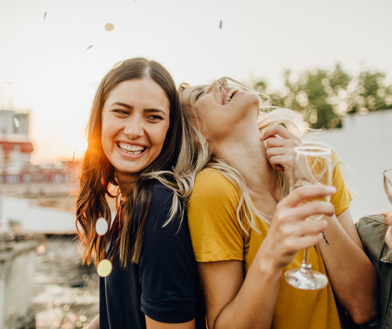 Photo of girlfriends on the rooftop, celebrating their friendship